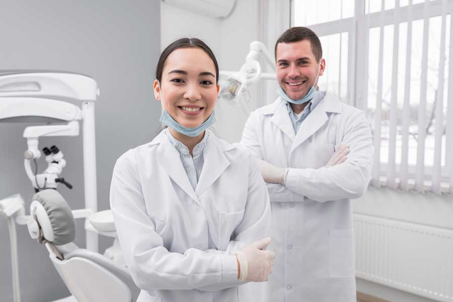 Two dentists smiling.
